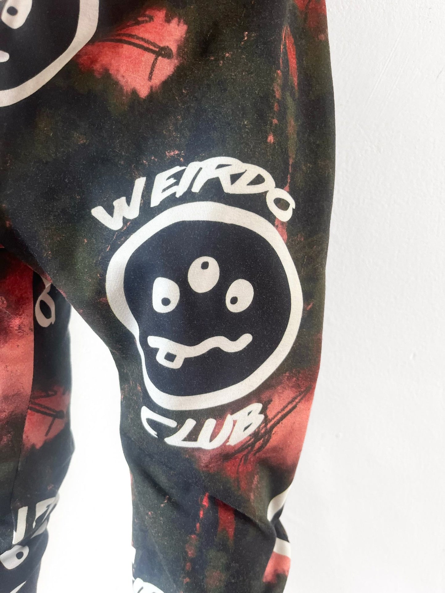 Unisex kids harem pants with Weirdo Club print and tie-dye design
