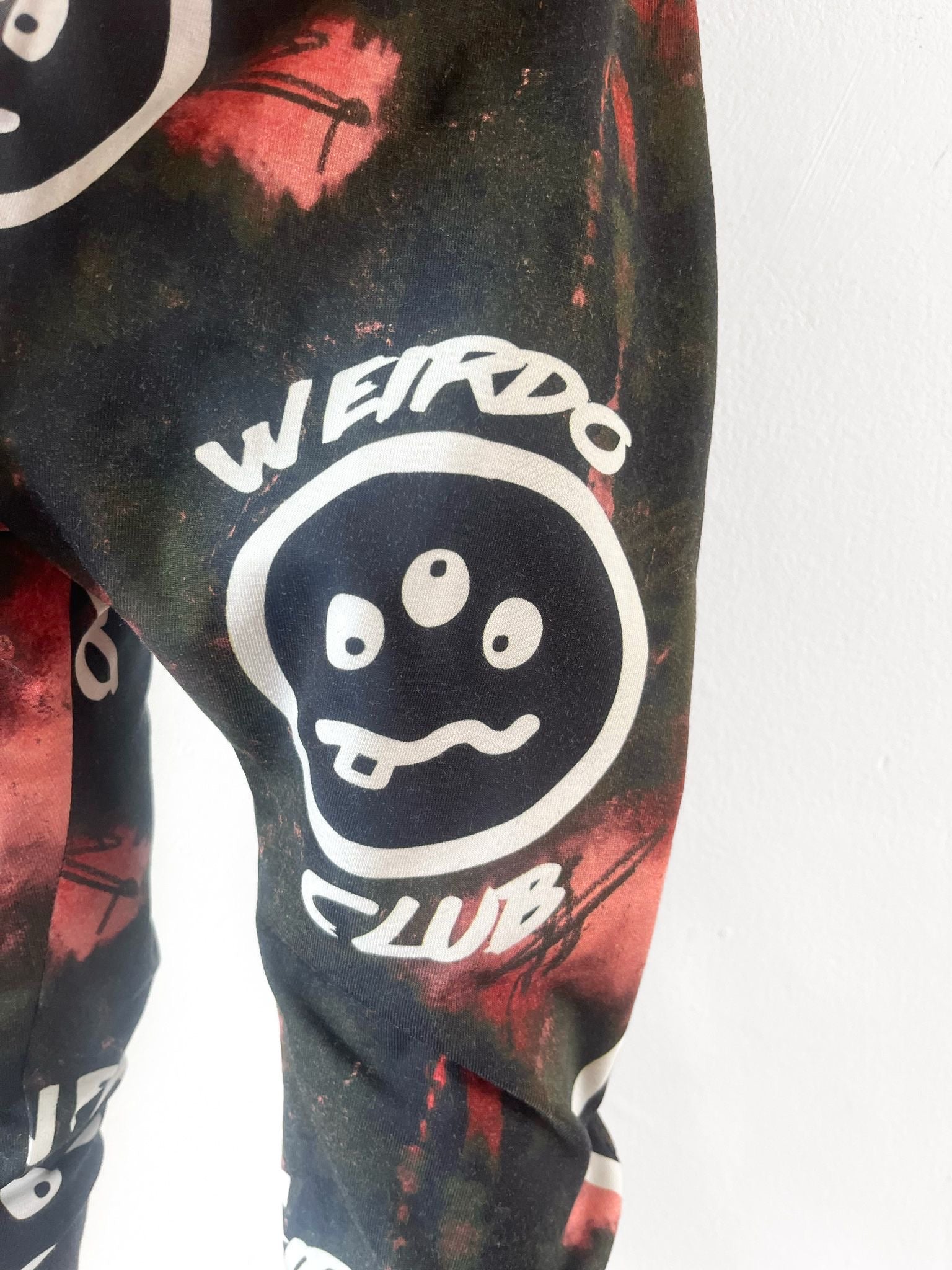 Unisex kids harem pants with Weirdo Club print and tie-dye design