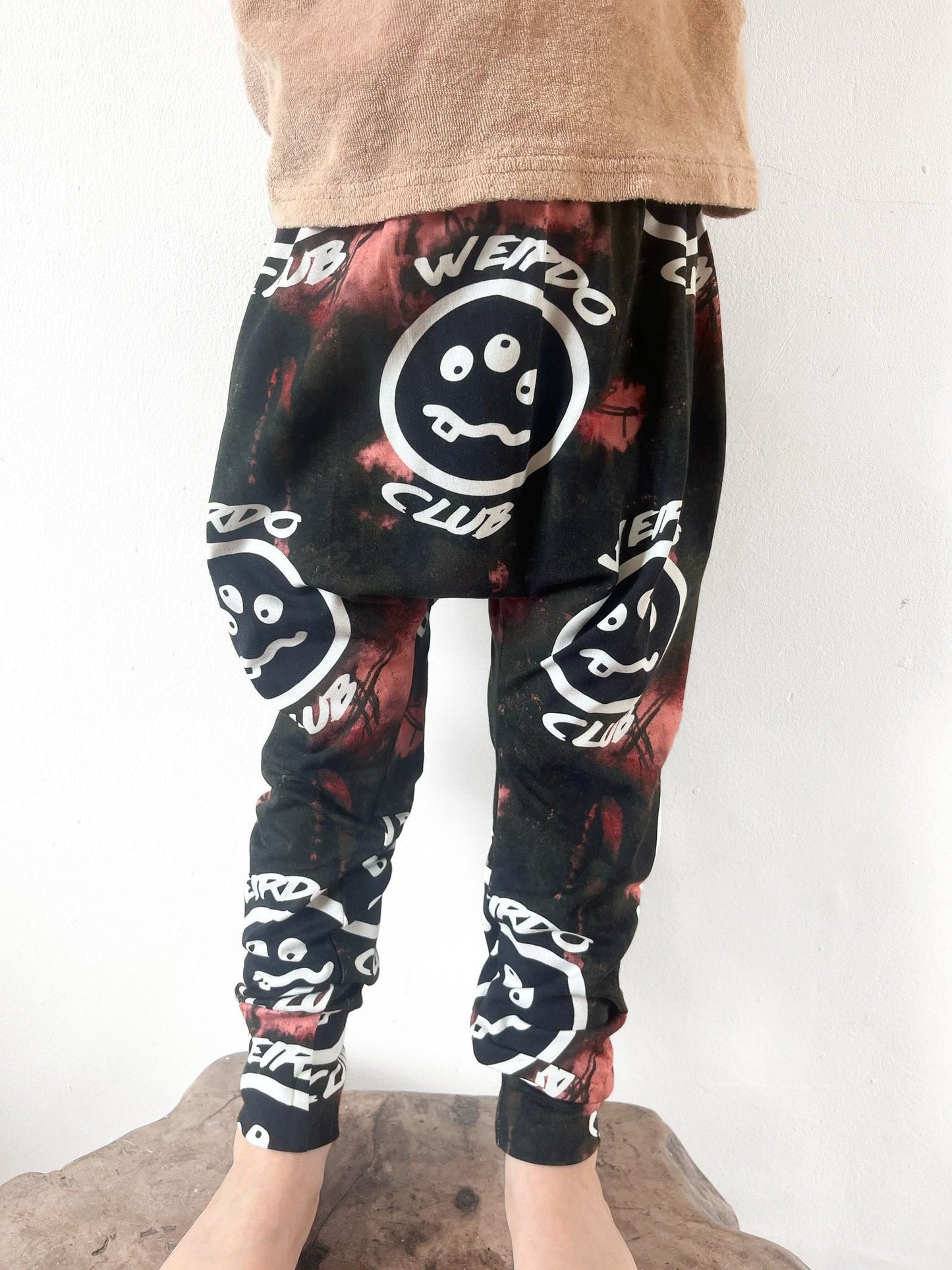Unisex kids harem pants with Weirdo Club print and tie-dye design