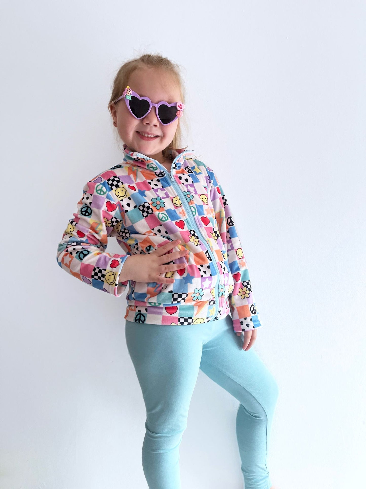 Y2K Pastel Patchwork Fleece Jacket for Kids – Smiley Face, Peace Sign & Heart Print, Groovy Check